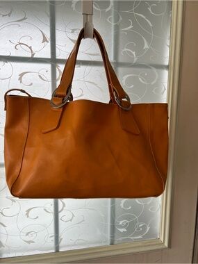 Aldo faux PVC leather tote to hobo bag in tangerine orange.